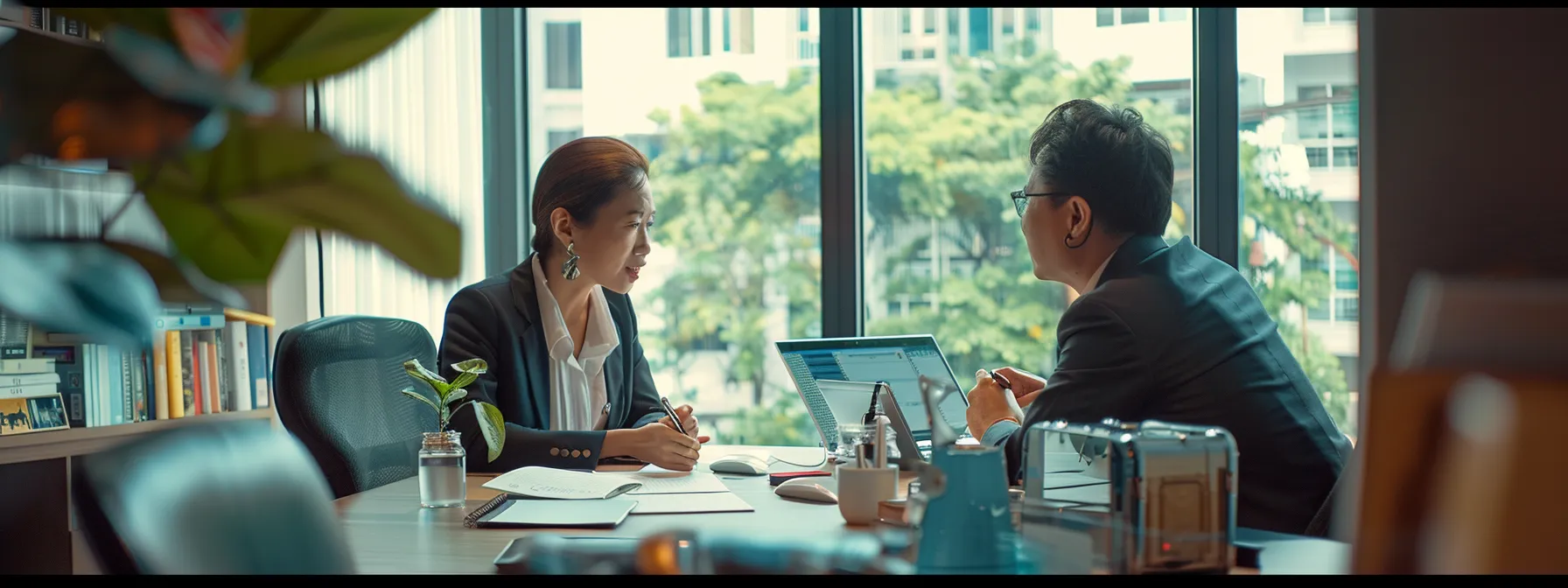 a person meeting with a housing agent in an office, discussing property management in bukit batok.