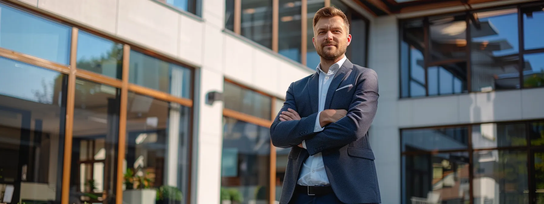 a newly licensed agent standing confidently in front of a sleek, modern real estate agency office.