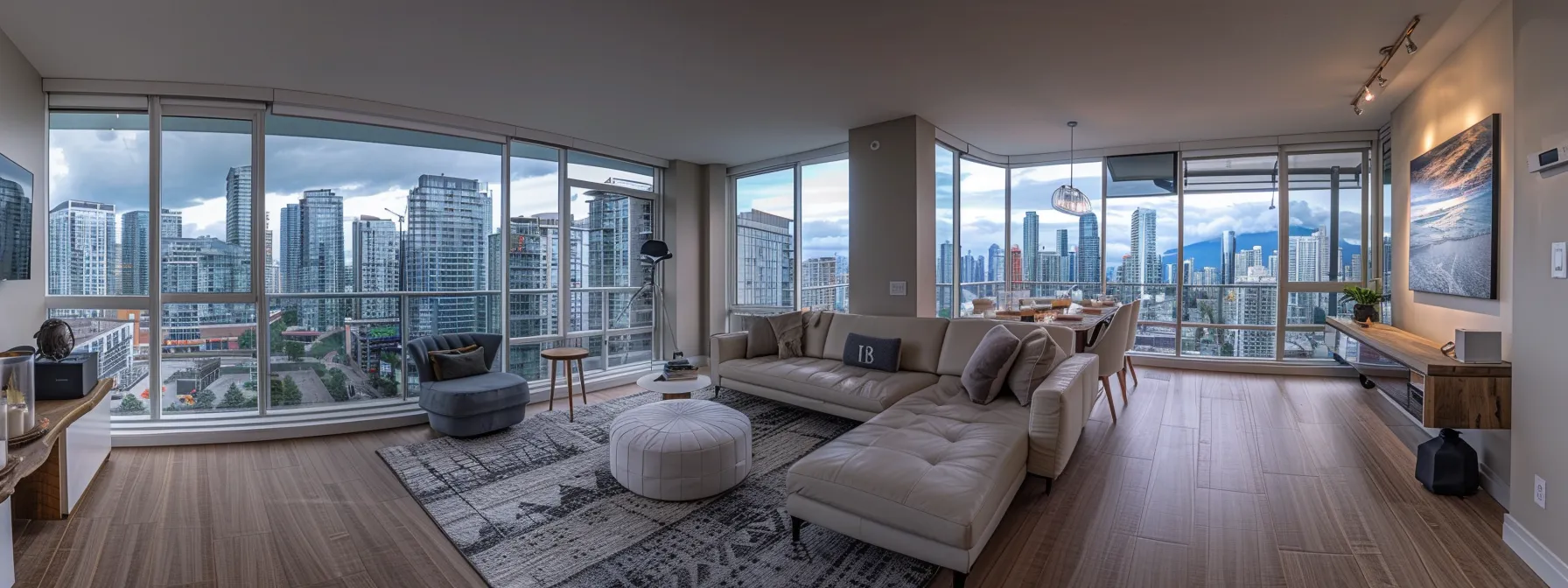 a luxurious, modern condo with a panoramic view of the city skyline and a sleek, sophisticated interior design.