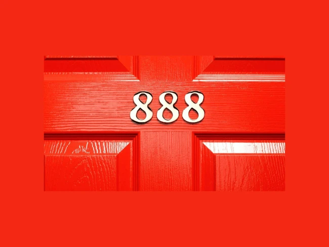 Red door featuring the lucky number 888, symbolizing prosperity in Singapore's HDB sales during Chinese New Year.