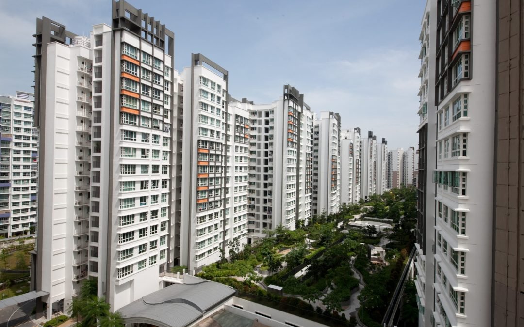 Modern residential buildings in Punggol, Singapore, showcasing landscaped gardens and contemporary architecture, relevant to ZaiDean Real Estate Agency's property offerings.